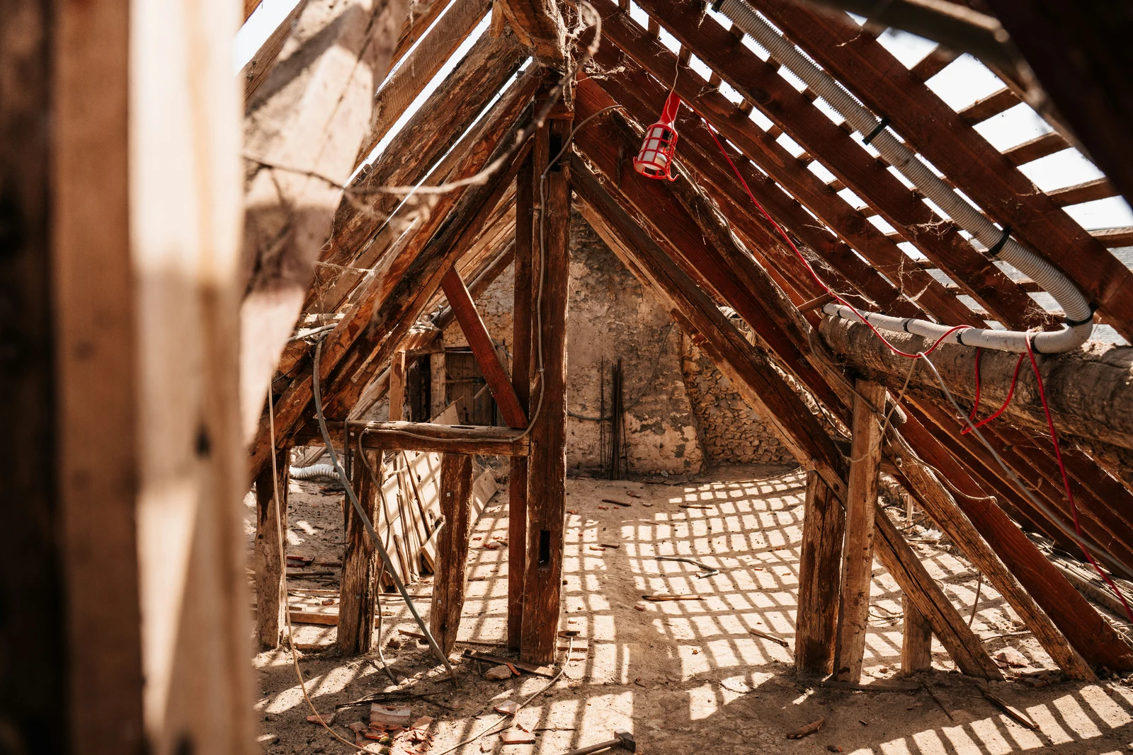 Wooden rafters and beams in an old structure.
